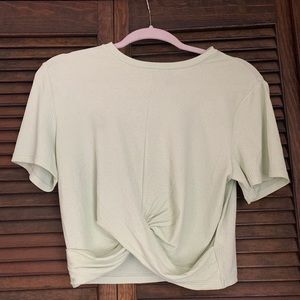 A mint green cropped short sleeve shirt.Never worn